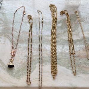 Gold chains and Betsey Johnson necklace. 7 total.